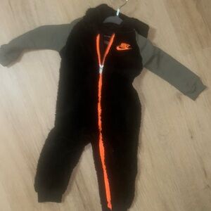 This cozy Nike jumpsuit is perfect for keeping your little one warm.